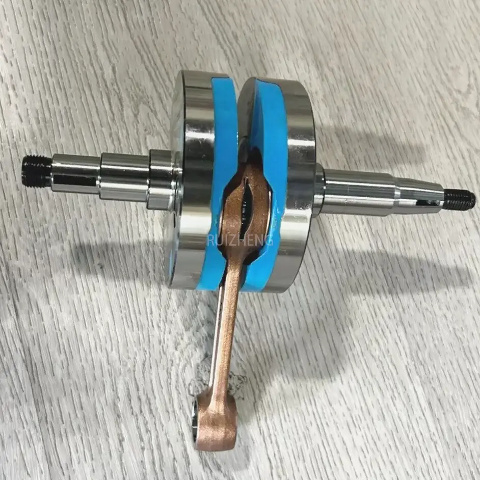 Close-up of Suzuki AX100 crankshaft connecting rod area