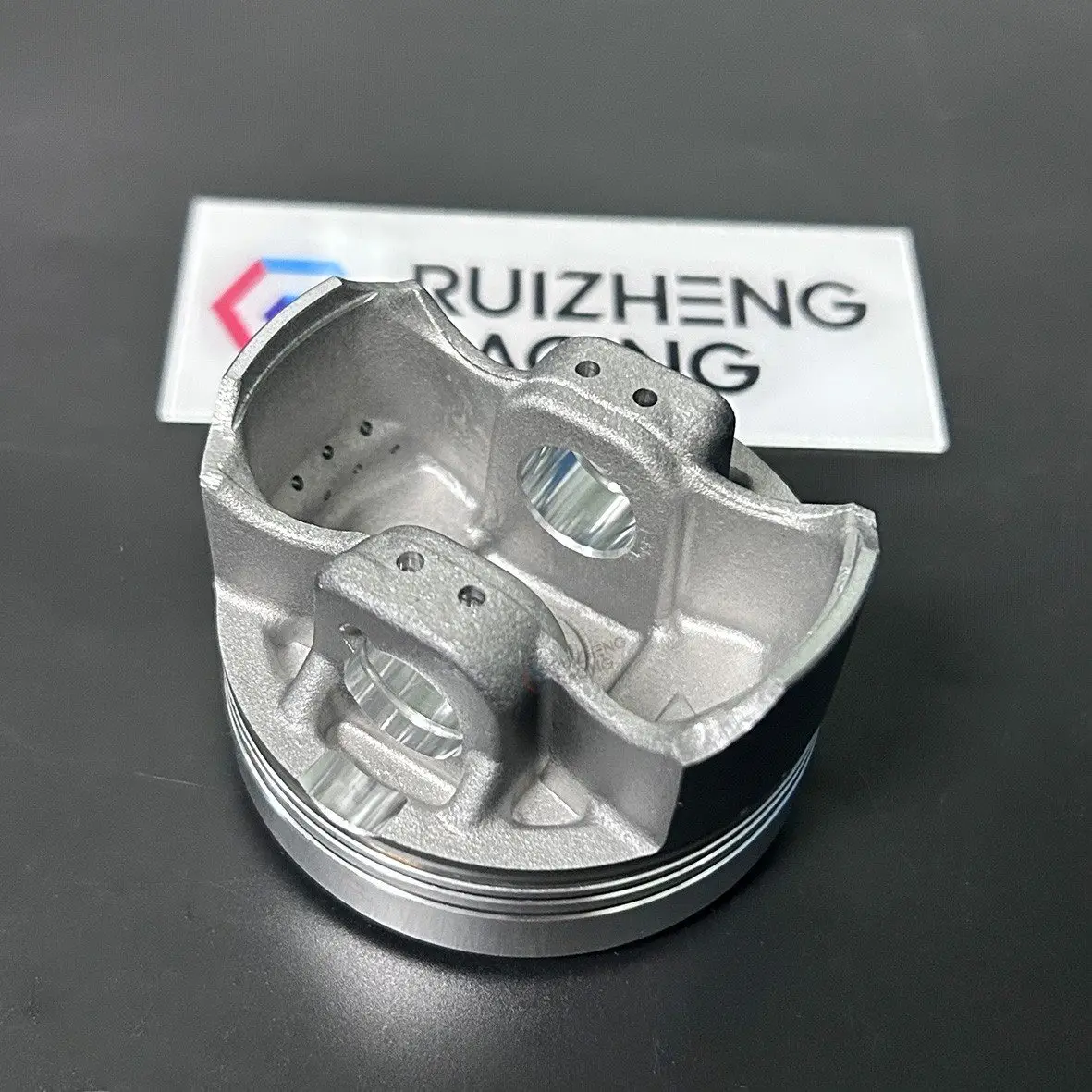 Cast motorcycle piston inner structure and pin bosses